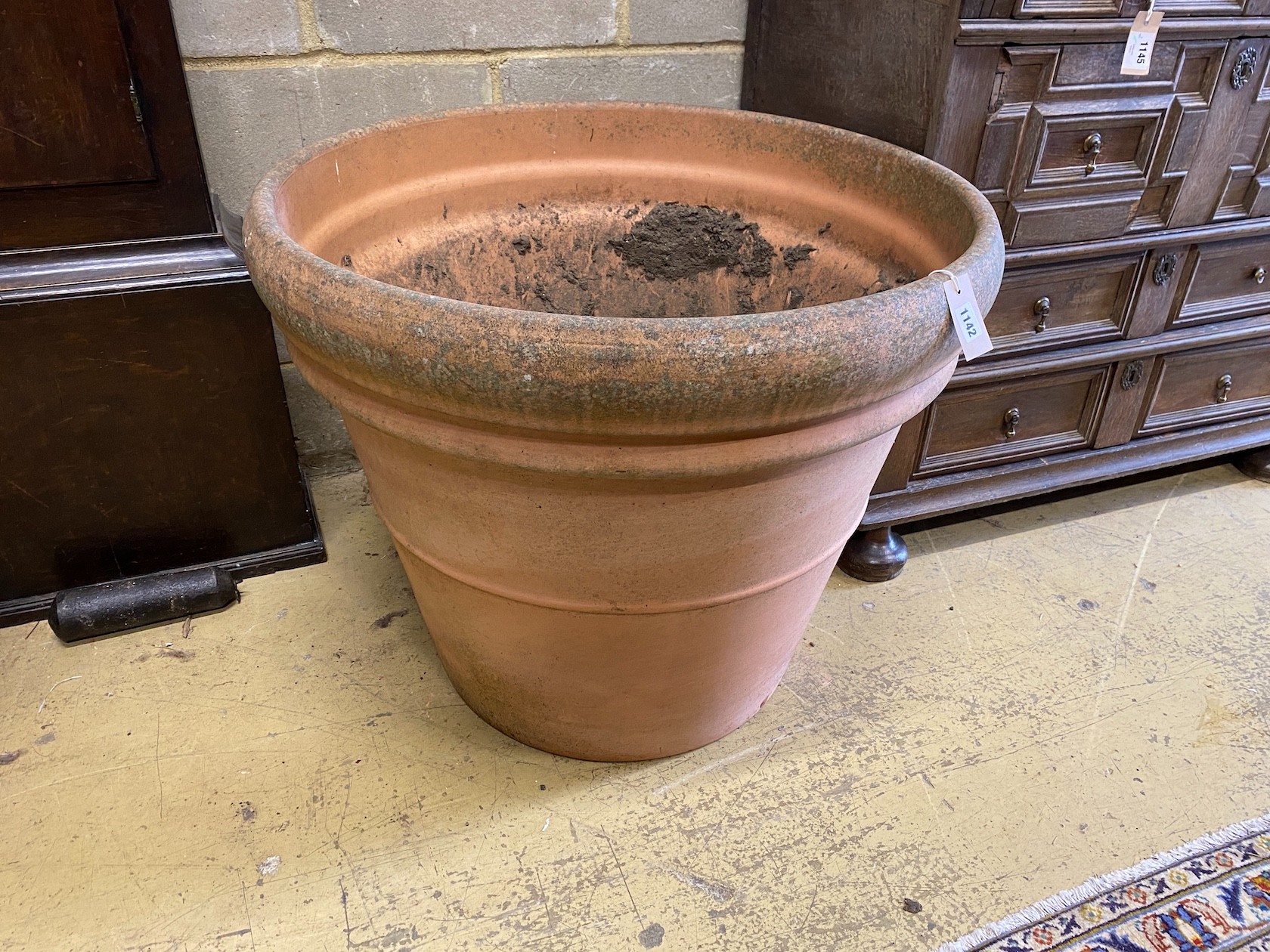 A large Italian circular terracotta garden planter, diameter 76cm, height 64cm